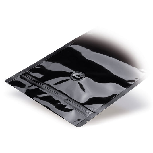 Stazakken zwart met aroma-beschermventiel — Detailweergave in een typische verpakkingstoepassing met voorbeeldinhoud